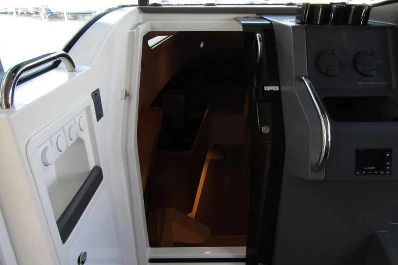 Slide: The Image of 2024 Nimbus Commuter 11 cabin entrance with modern controls and sleek design. - 46