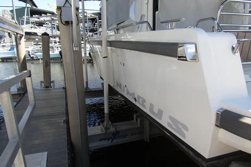 Slide: The Image of 2024 Nimbus Commuter 11 docked at marina, showcasing sleek design and modern features. - 5