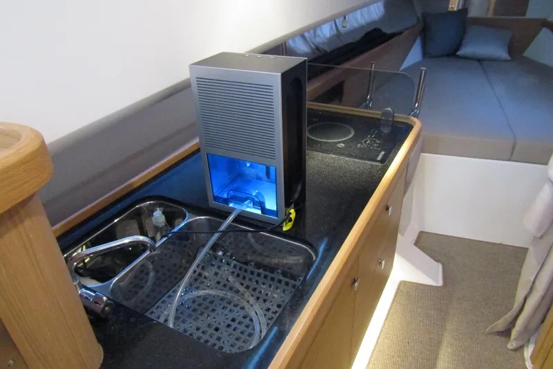 Slide: The Image of 2024 Nimbus Commuter 11 interior with modern kitchen sink and compact appliance. - 51
