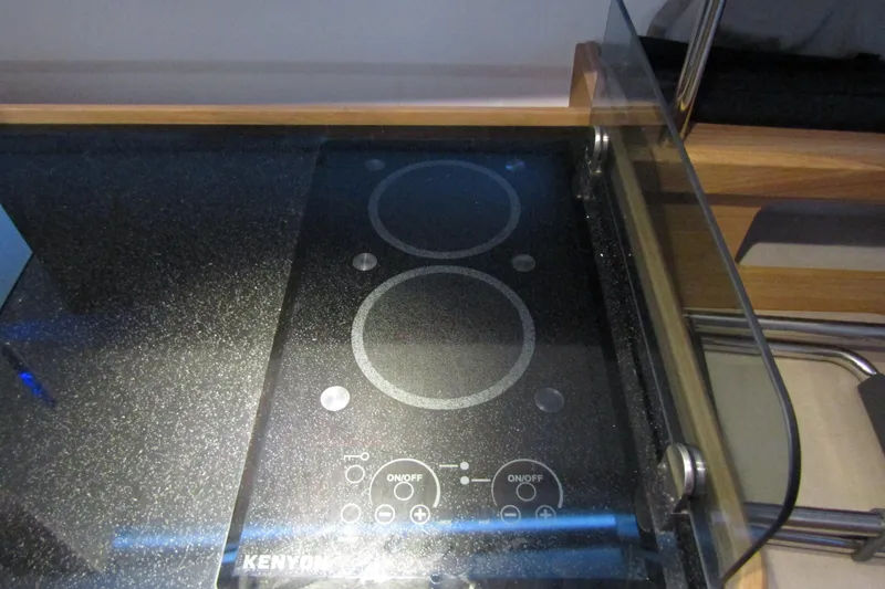 Slide: The Image of Modern Kenyon electric cooktop on Nimbus Commuter 11, 2024 model, with dual burners. - 52