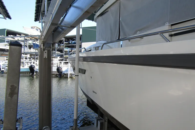 Slide: The Image of 2024 Nimbus Commuter 11 docked at marina, showcasing sleek design and modern features. - 6