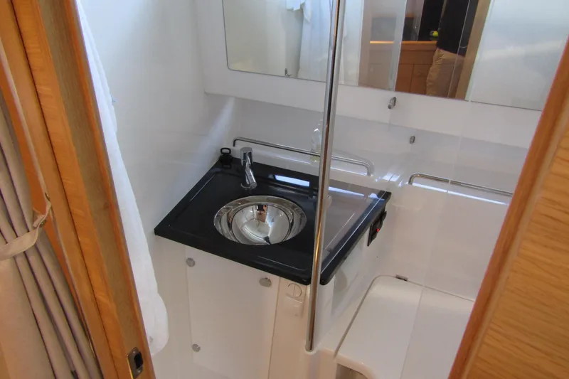 Slide: The Image of Compact bathroom interior of 2024 Nimbus Commuter 11 with sink and mirror. - 60