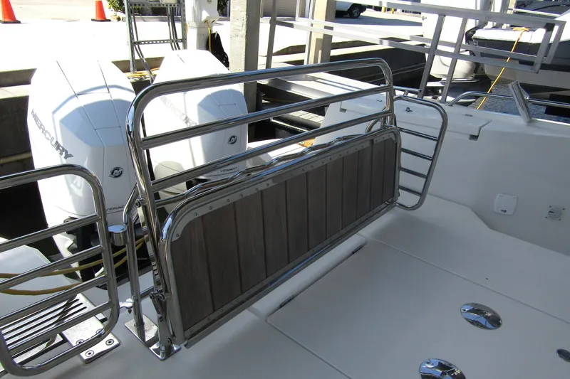 Slide: The Image of 2024 Nimbus Commuter 11 boat with Mercury engines and stainless steel railing. - 9