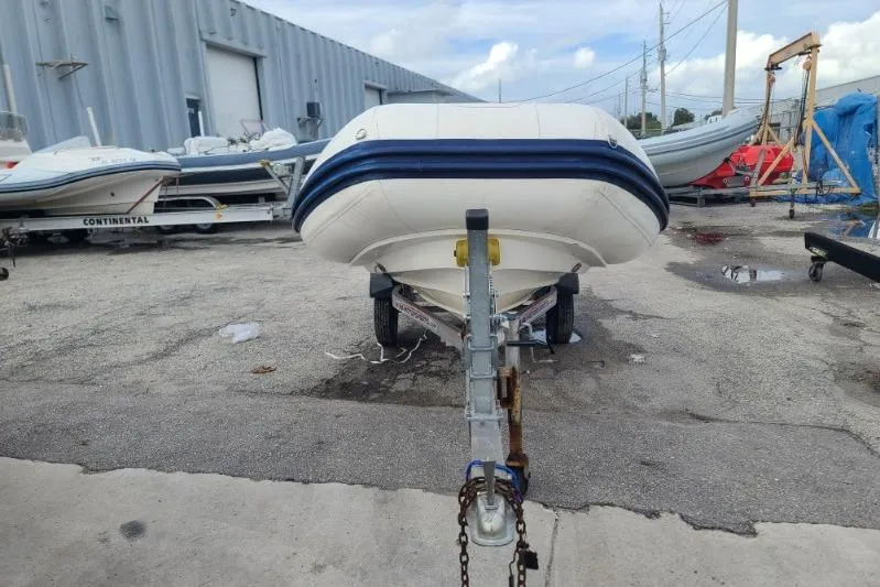 Slide: The Image of 2015 Williams 385 boat on trailer in marina storage area. - 3