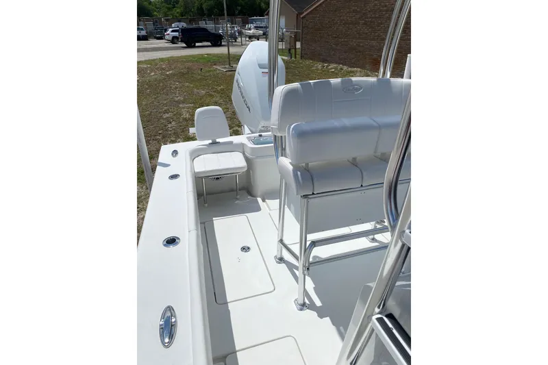 Slide: The Image of 2026 Pair Customs 21 Center Console MV boat interior with white seating and sleek design. - 10