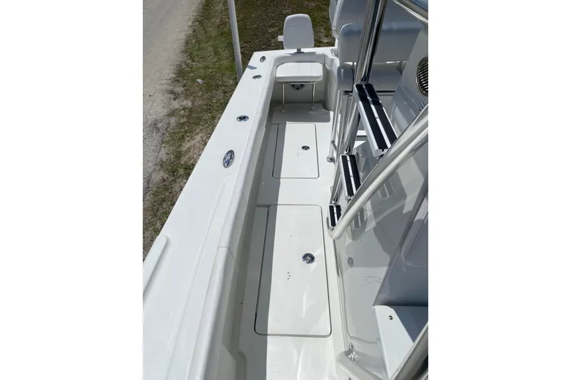 Slide: The Image of 2026 Pair Customs 21 Center Console MV boat interior with sleek white deck design. - 11