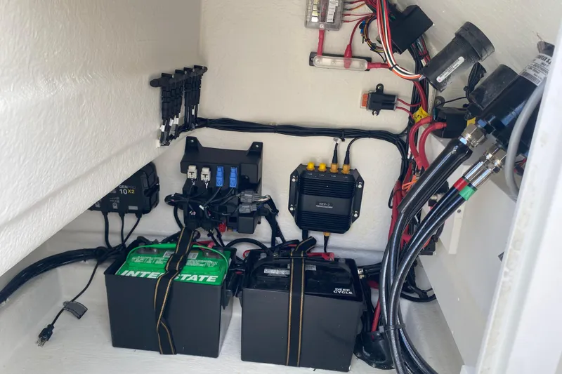 Slide: The Image of Electrical system of 2026 Pair Customs 21 Center Console MV boat, featuring batteries and wiring. - 12