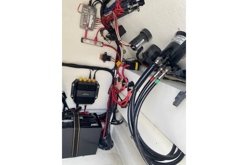 Slide: The Image of Electrical wiring and components inside a 2026 Pair Customs 21 Center Console MV boat. - 13