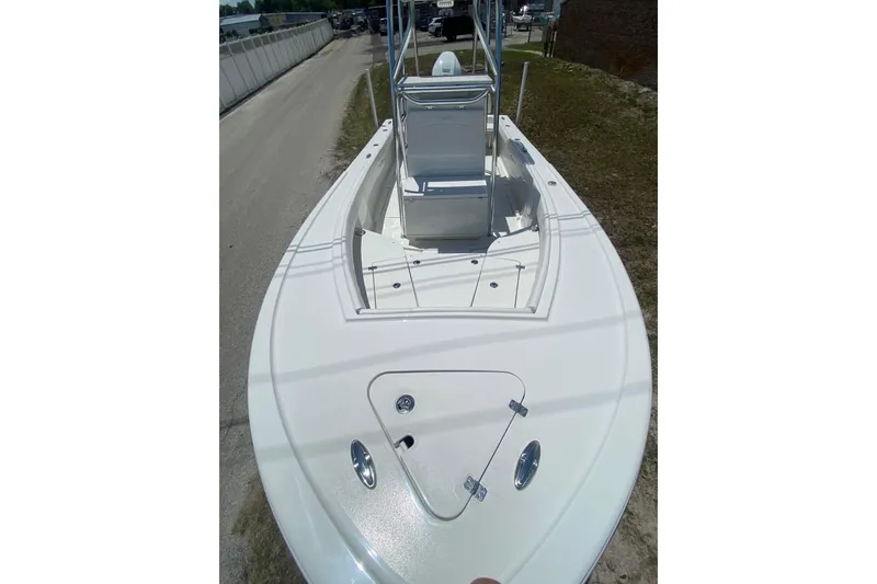 Slide: The Image of 2026 Pair Customs 21 Center Console MV boat, white deck, sleek design, outdoor setting. - 15