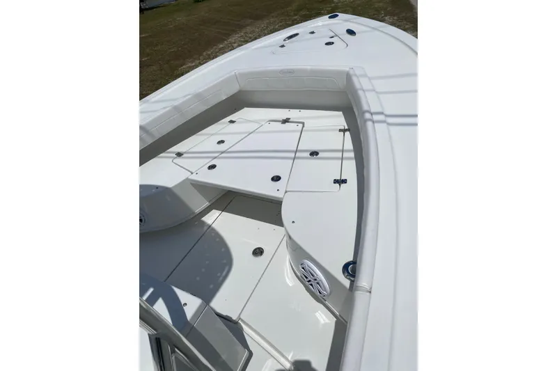 Slide: The Image of 2026 Pair Customs 21 Center Console MV boat interior, featuring sleek white deck design. - 6