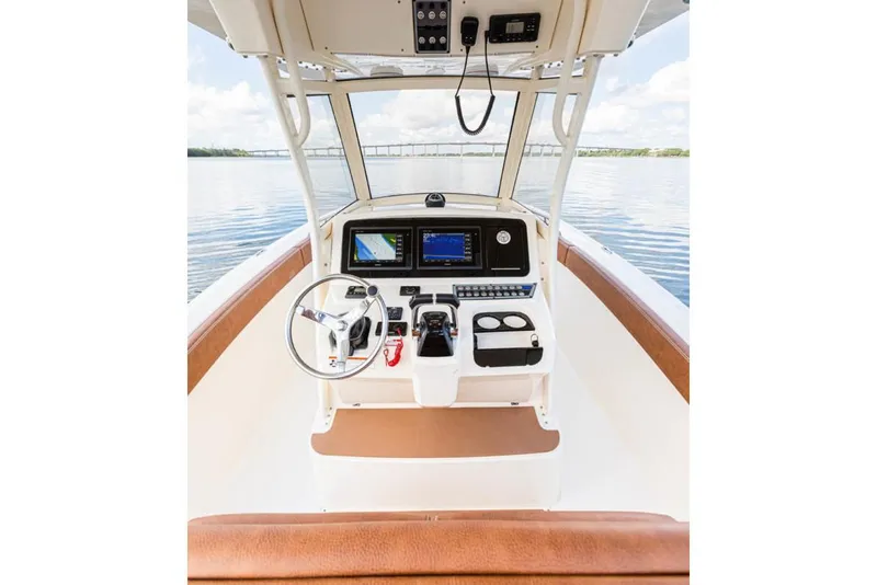 Slide: The Image of Manufacturer Provided Image: 2021 Scout 277 LXF boat helm with advanced navigation systems. - 13