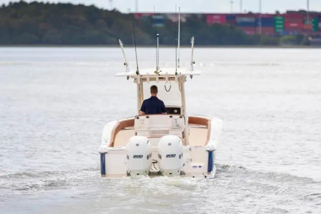 Slide: The Image of Manufacturer Provided Image: 2021 Scout 277 LXF boat cruising on a calm lake. - 4