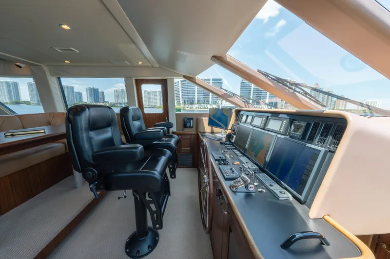 Slide: The Image of Luxurious 2007 Pacific Mariner Pilothouse interior with modern navigation equipment and leather seating. - 11