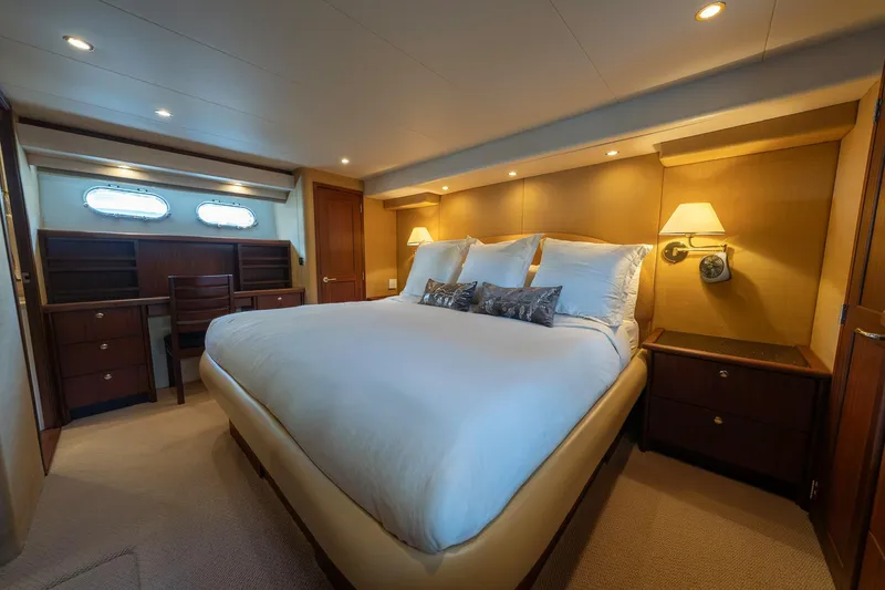 Slide: The Image of Luxurious 2007 Pacific Mariner Pilothouse yacht bedroom with elegant furnishings and ambient lighting. - 16