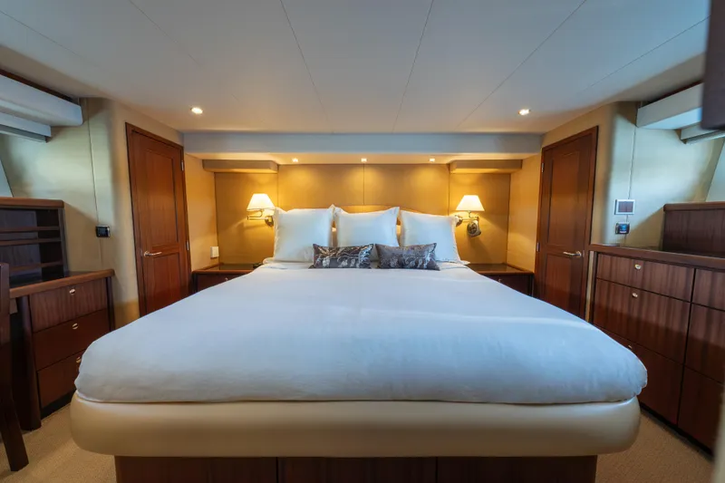 Slide: The Image of Luxurious bedroom interior of 2007 Pacific Mariner Pilothouse yacht with elegant wood furnishings. - 17