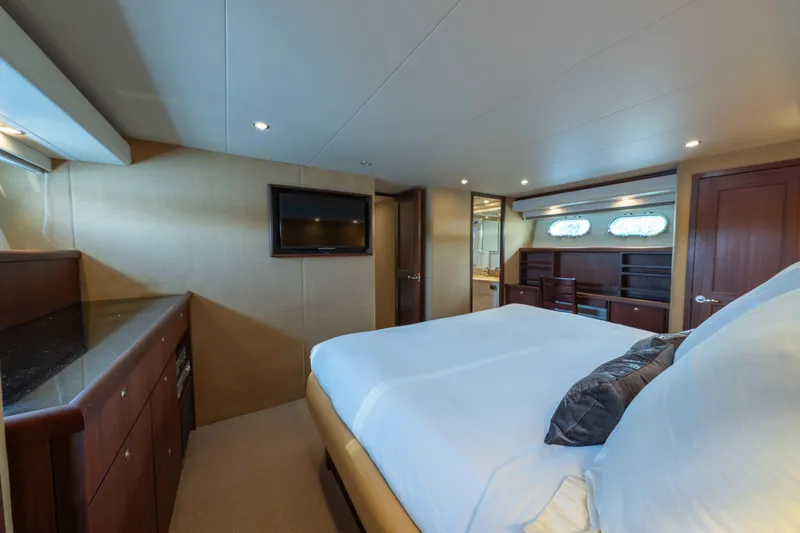 Slide: The Image of Luxurious 2007 Pacific Mariner Pilothouse yacht bedroom with modern amenities and elegant design. - 18