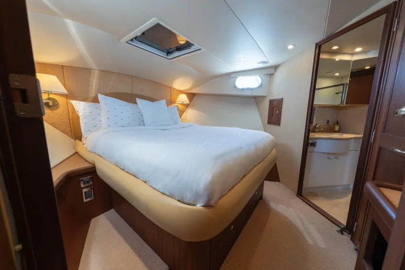 Slide: The Image of Luxurious 2007 Pacific Mariner Pilothouse yacht bedroom with plush bedding and elegant lighting. - 21