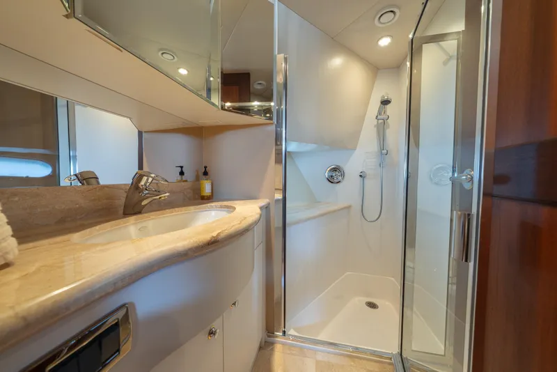 Slide: The Image of Luxurious 2007 Pacific Mariner Pilothouse yacht bathroom with modern shower and elegant sink. - 23