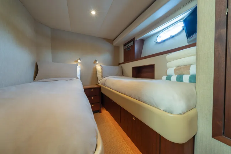 Slide: The Image of Luxurious twin cabin interior of 2007 Pacific Mariner Pilothouse yacht with cozy bedding. - 25