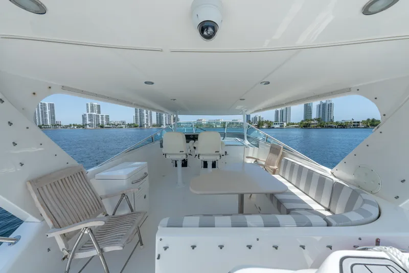 Slide: The Image of Luxurious 2007 Pacific Mariner Pilothouse yacht interior with seating, table, and waterfront view. - 27
