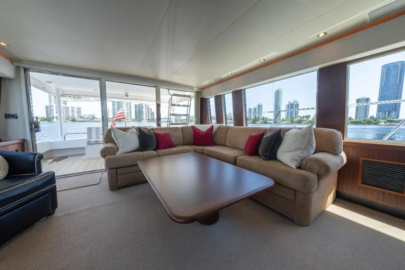 Slide: The Image of Luxurious 2007 Pacific Mariner Pilothouse yacht interior with plush seating and scenic city views. - 3