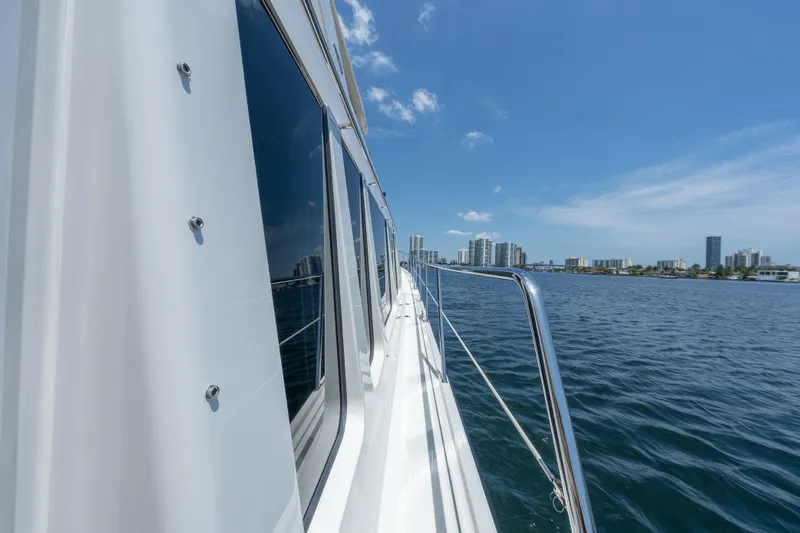 Slide: The Image of 2007 Pacific Mariner Pilothouse yacht cruising near city skyline on a sunny day. - 34