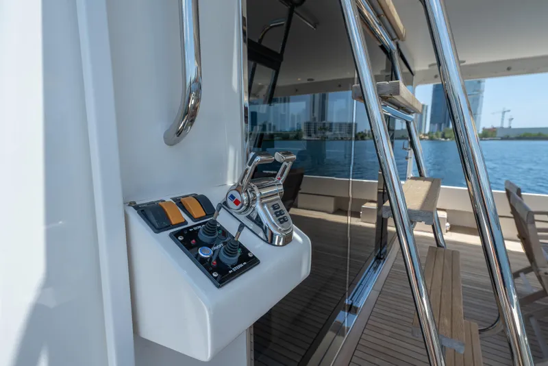 Slide: The Image of 2007 Pacific Mariner Pilothouse yacht controls with ocean view and sleek design elements. - 38
