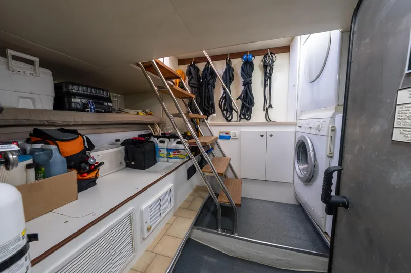Slide: The Image of Laundry and storage area inside a 2007 Pacific Mariner Pilothouse yacht. - 43