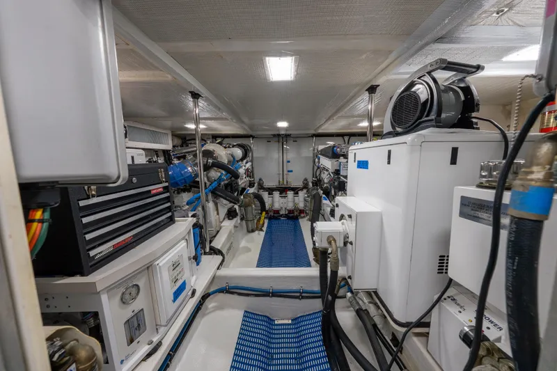 Slide: The Image of Engine room of a 2007 Pacific Mariner Pilothouse yacht, showcasing machinery and equipment. - 44