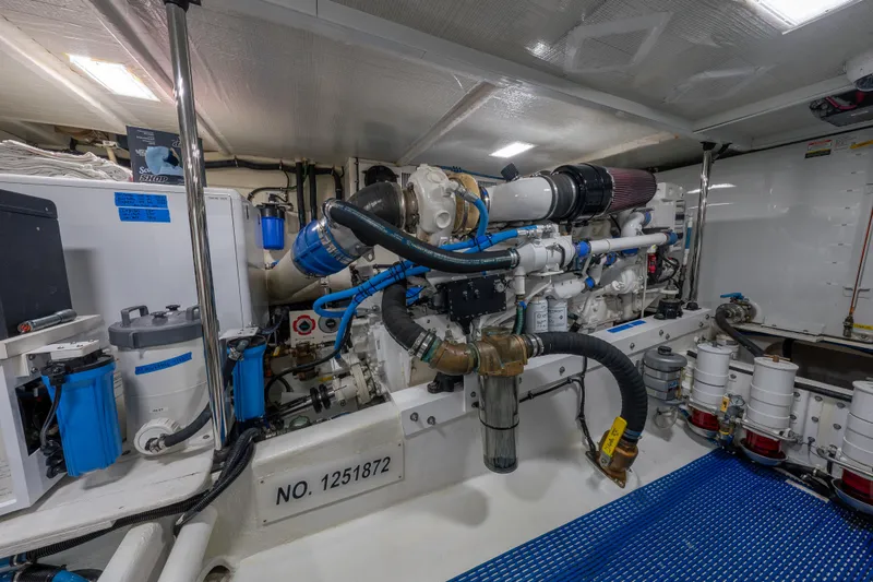 Slide: The Image of Engine room of a 2007 Pacific Mariner Pilothouse yacht, showcasing detailed machinery and components. - 45