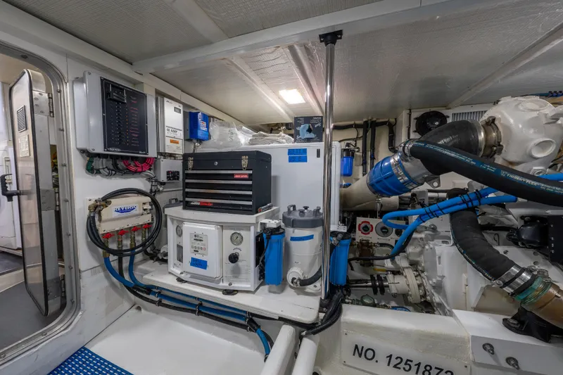 Slide: The Image of Engine room of a 2007 Pacific Mariner Pilothouse yacht, showcasing mechanical systems and equipment. - 46