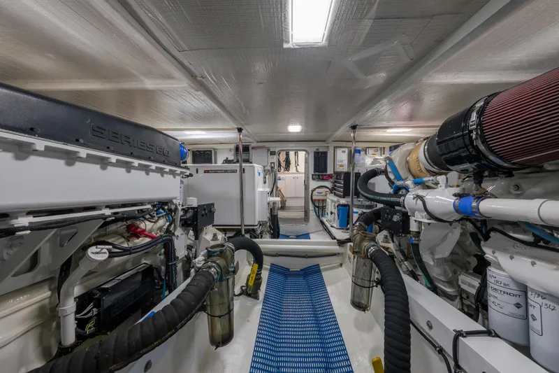 Slide: The Image of Engine room of a 2007 Pacific Mariner Pilothouse yacht, showcasing mechanical components and systems. - 47