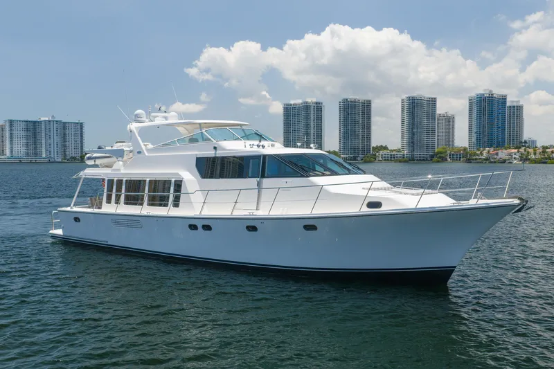 Slide: The Image of 2007 Pacific Mariner Pilothouse yacht cruising near city skyline on a sunny day. - 49