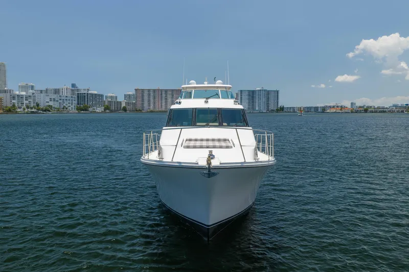 Slide: The Image of 2007 Pacific Mariner Pilothouse yacht on calm water with city skyline in background. - 50