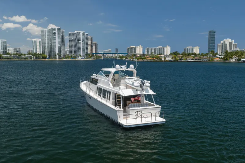 Slide: The Image of 2007 Pacific Mariner Pilothouse yacht cruising near city skyline on a sunny day. - 51