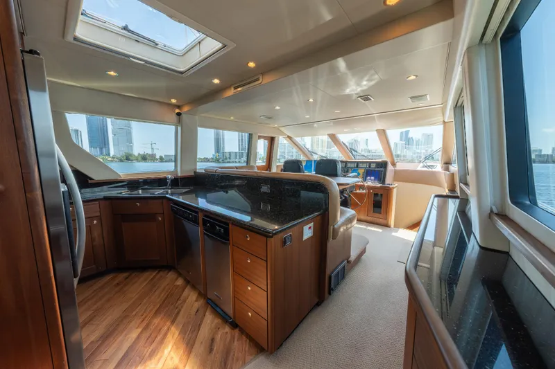 Slide: The Image of Luxurious 2007 Pacific Mariner Pilothouse interior with modern kitchen and panoramic city views. - 8