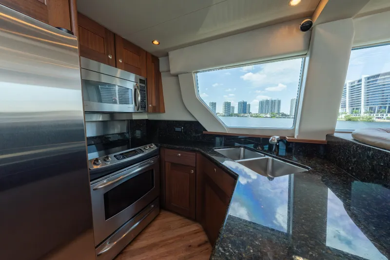 Slide: The Image of Luxurious kitchen interior of 2007 Pacific Mariner Pilothouse yacht with cityscape view. - 9
