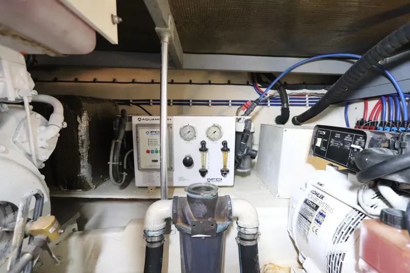 Slide: The Image of Engine room of 2004 Luhrs 38 Convertible with control panels and wiring. - 10