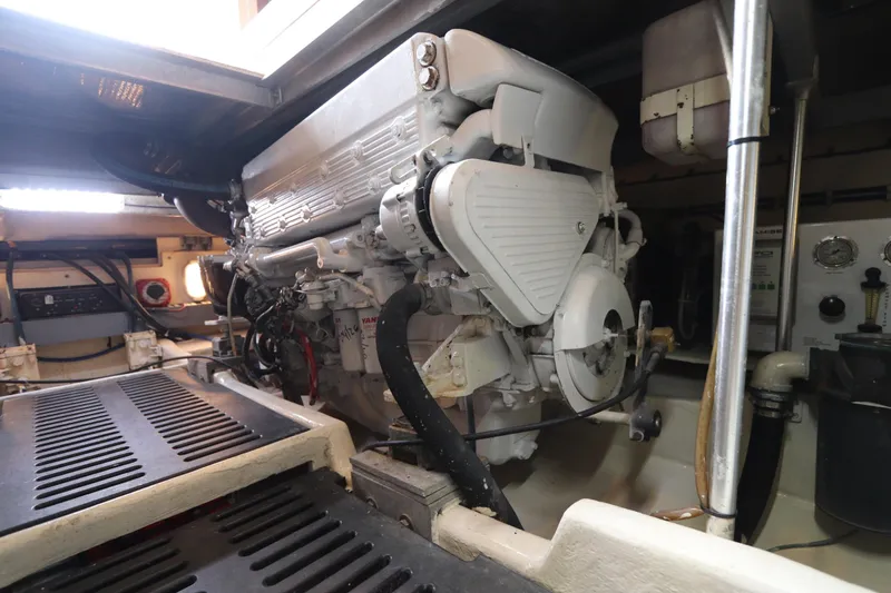 Slide: The Image of Engine room of 2004 Luhrs 38 Convertible boat, showcasing machinery and components. - 11