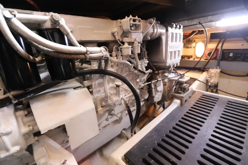 Slide: The Image of Engine room of 2004 Luhrs 38 Convertible boat, showcasing mechanical components and wiring. - 13