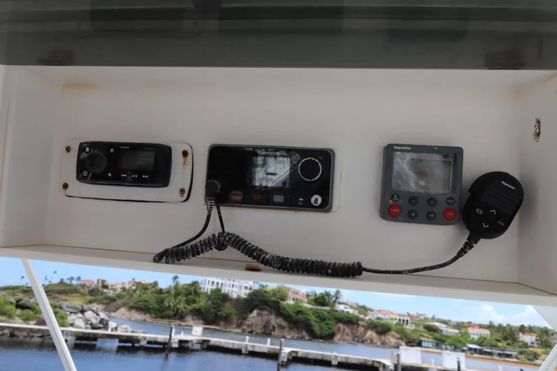 Slide: The Image of 2004 Luhrs 38 Convertible boat dashboard with navigation and communication equipment. - 17