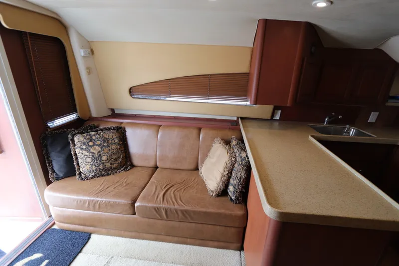Slide: The Image of Interior of 2004 Luhrs 38 Convertible yacht with leather sofa and kitchen counter. - 3