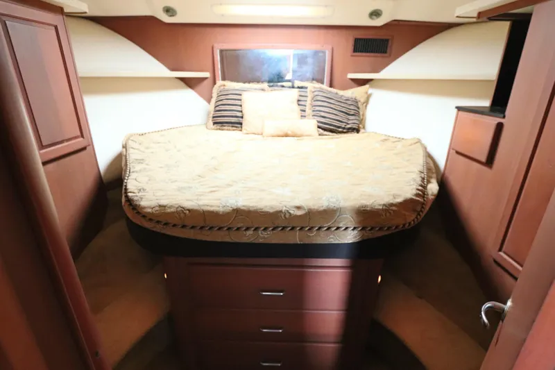Slide: The Image of Luxurious cabin interior of 2004 Luhrs 38 Convertible yacht with cozy bedding. - 6