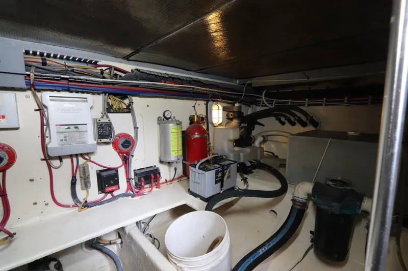 Slide: The Image of Engine room of 2004 Luhrs 38 Convertible boat with wiring and equipment. - 8
