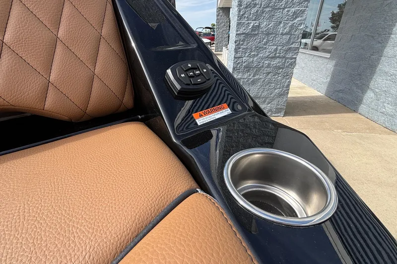 Slide: The Image of 2026 Tigé Z3 boat interior with brown leather seats and cup holder. - 13