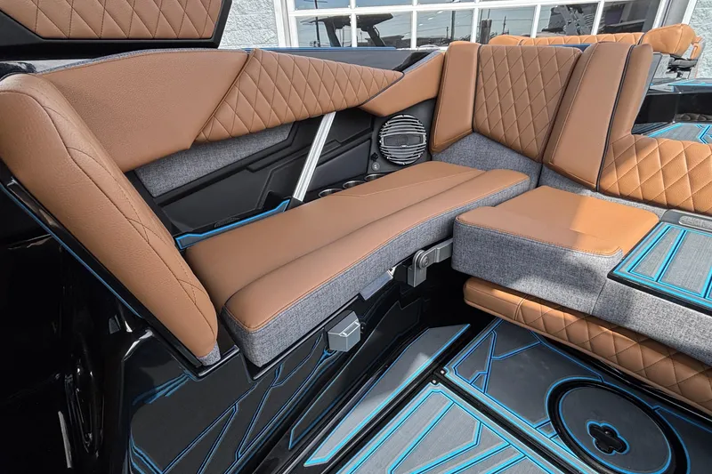 Slide: The Image of 2026 Tigé Z3 boat interior with luxurious brown and gray seating, featuring diamond stitching. - 15