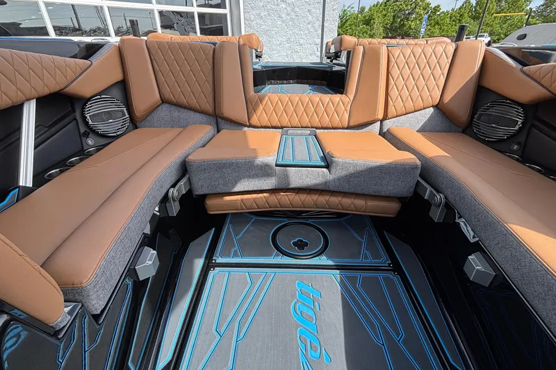 Slide: The Image of Luxurious interior of 2026 Tigé Z3 boat with tan and gray seating. - 16