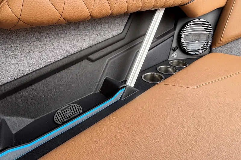 Slide: The Image of 2026 Tigé Z3 interior with brown leather seats, speaker, and cup holders. - 18