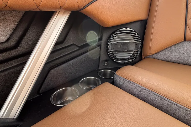 Slide: The Image of 2026 Tigé Z3 interior with brown leather seats, speaker, and cup holders. - 20