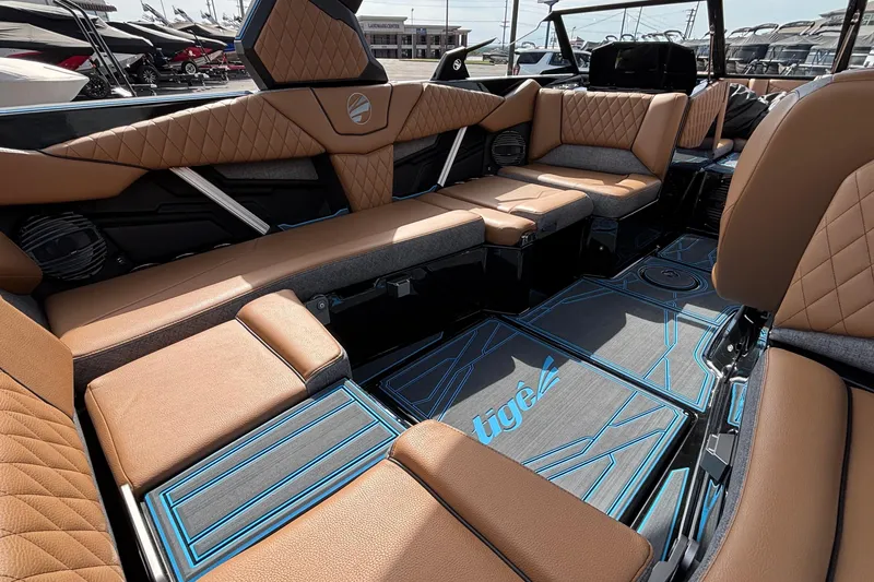 Slide: The Image of Luxurious interior of 2026 Tigé Z3 boat with tan leather seating and modern design. - 21
